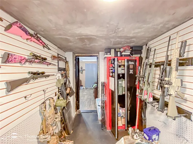 a view of walk in closet with clothes