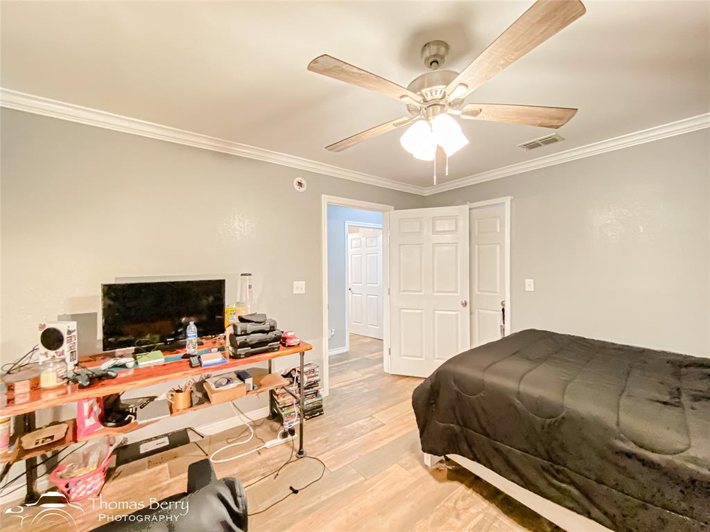 355 Farm To Market 604 Clyde, TX 79510 - Photo 10 of 30 a bedroom with a bed and a flat tv screen on a dresser