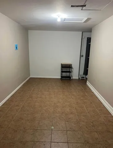 a view of a deck with wooden floor and outdoor seating