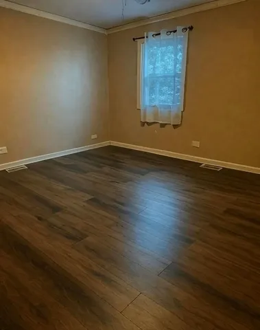 a group of people sitting in front of a house
