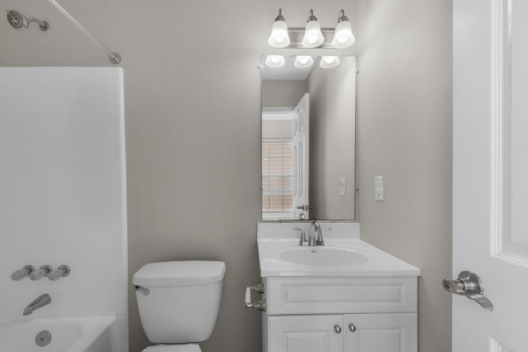 2 Falcon Ridge Lane Fort Walton Beach, FL 32547 - Photo 16 of 24 a bathroom with a toilet a sink and a mirror