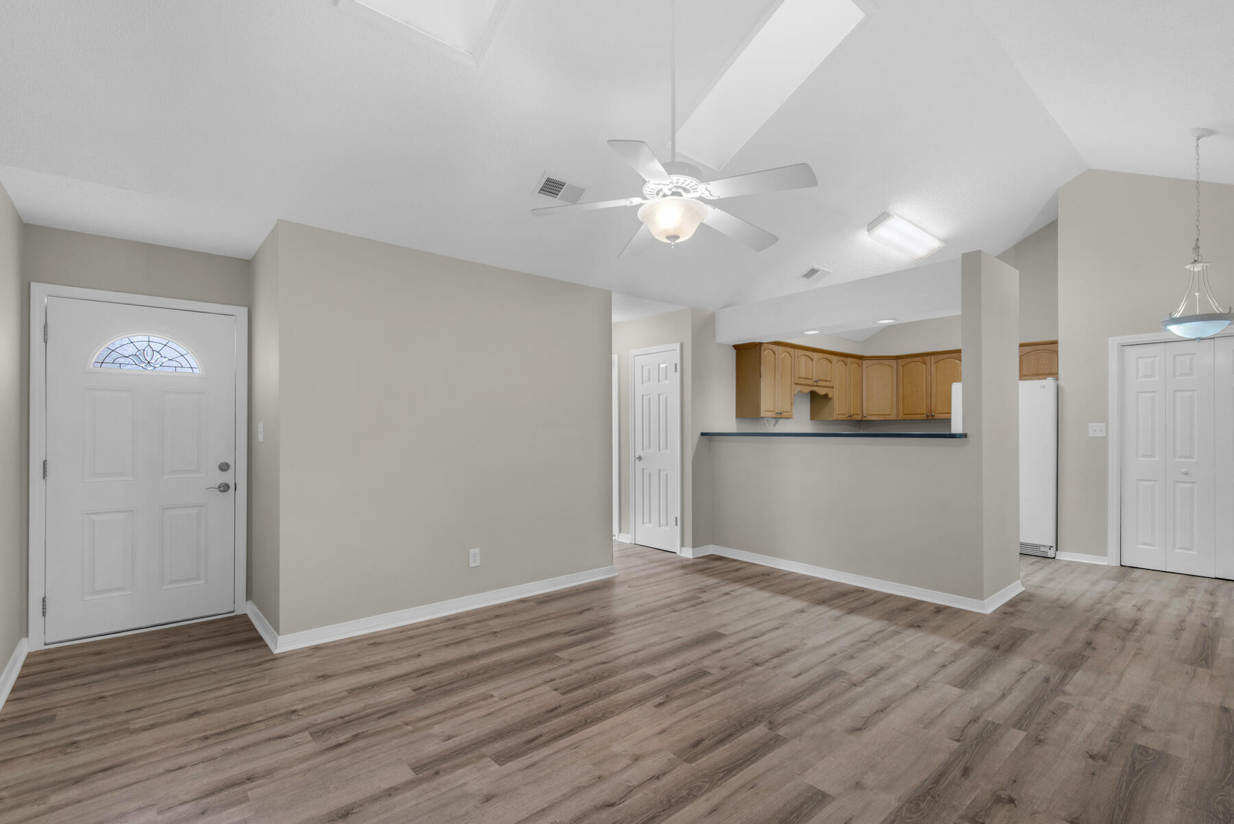 2 Falcon Ridge Lane Fort Walton Beach, FL 32547 - Photo 5 of 24 a view of a kitchen with wooden floor and a ceiling fan