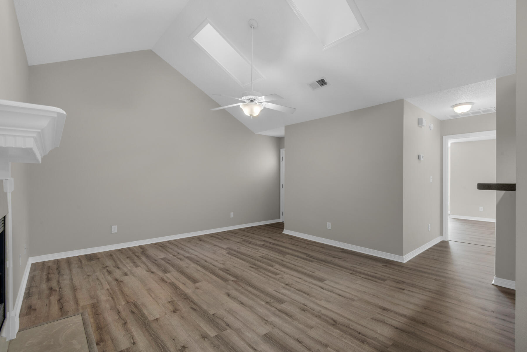 2 Falcon Ridge Lane Fort Walton Beach, FL 32547 - Photo 6 of 24 wooden floor in an empty room with a window