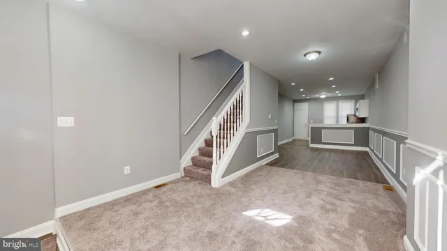 a view of entryway and hall with a dining table
