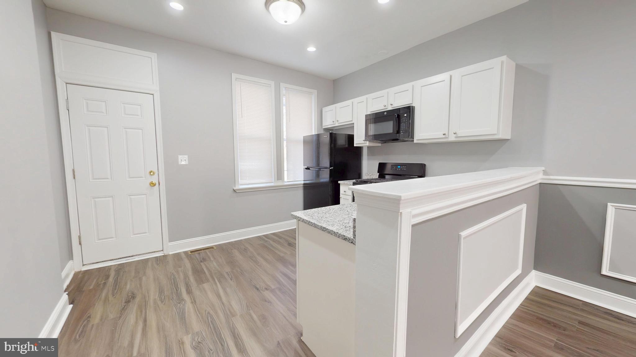 1824 Federal Street Baltimore, MD 21213 - Photo 6 of 17 a view of a kitchen with electric appliances