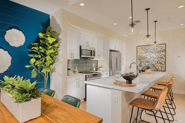 a kitchen with a table chair and microwave