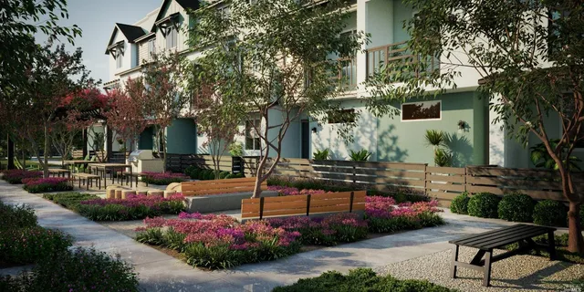 a view of a backyard with sitting area