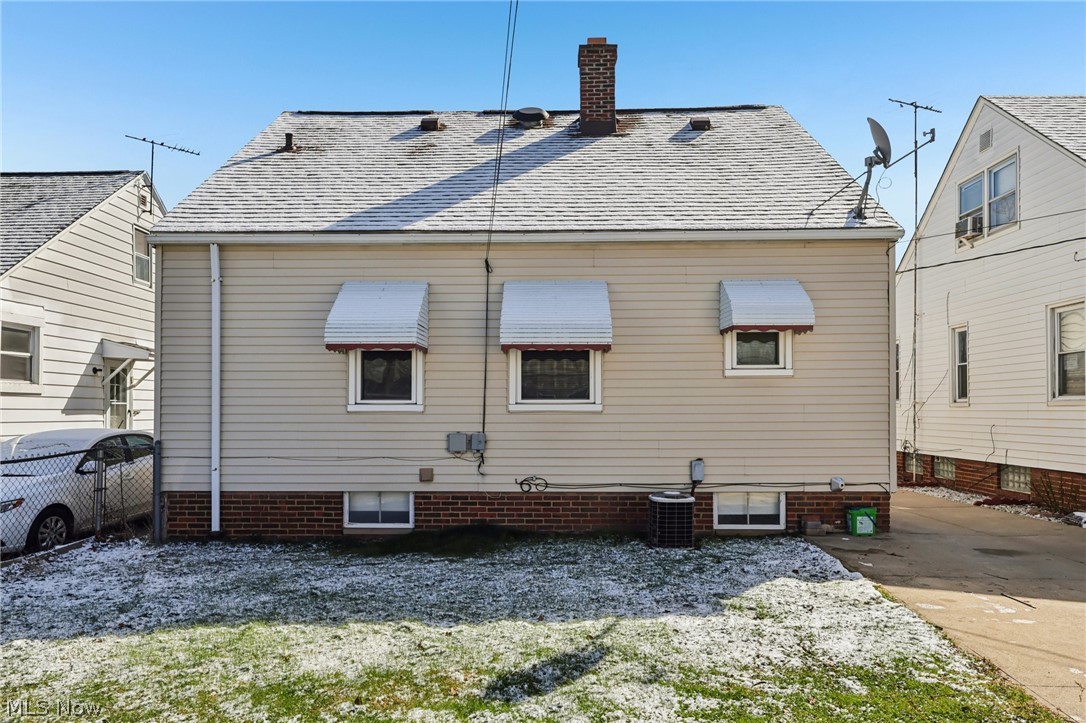 4252 Ridgeview Road Cleveland, OH 44144 - Photo 30 of 37 Back of house with a chimney and roof with shingles