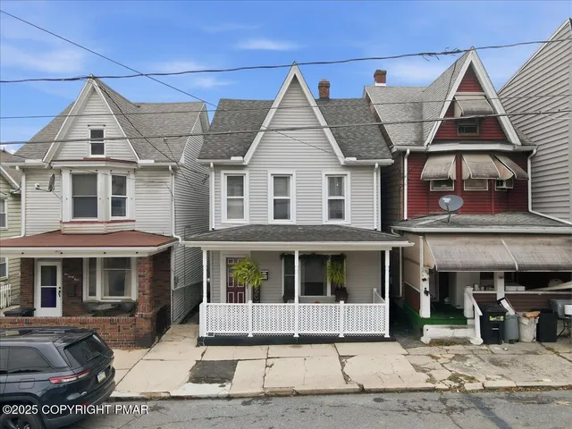 a view of a white building among the street