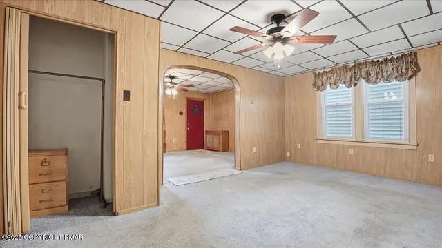 a kitchen with stainless steel appliances granite countertop a stove a sink dishwasher and a refrigerator with wooden floor