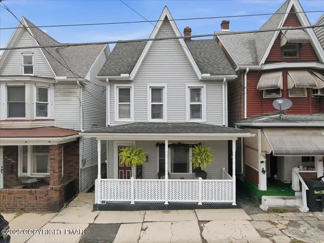 a front view of a house with a porch