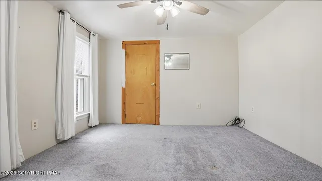 a view of entryway with stairs and wooden floor