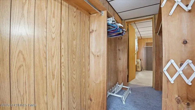 a view of a chair and tables in the balcony