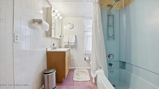 a front view of a house with a yard deck and a garden