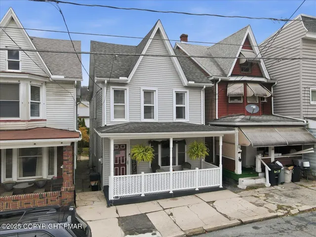 a view of a white building among the street