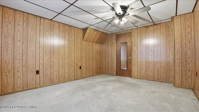 an aerial view of a house with a garden