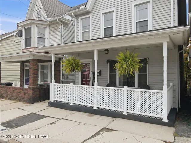 a view of a livingroom with a furniture