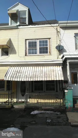 a front view of a house with parking