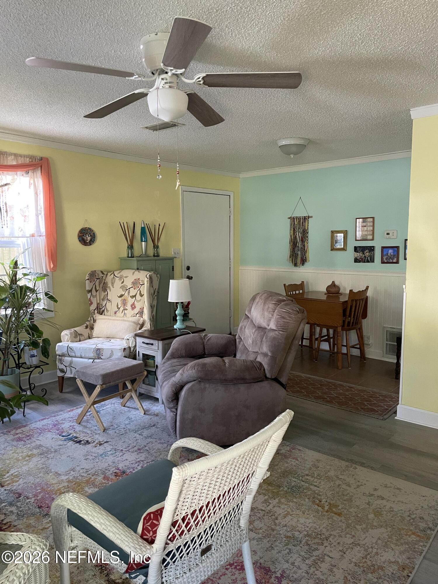 709 North 11th Street Palatka, FL 32177 - Photo 8 of 33 a living room with furniture and wooden floor