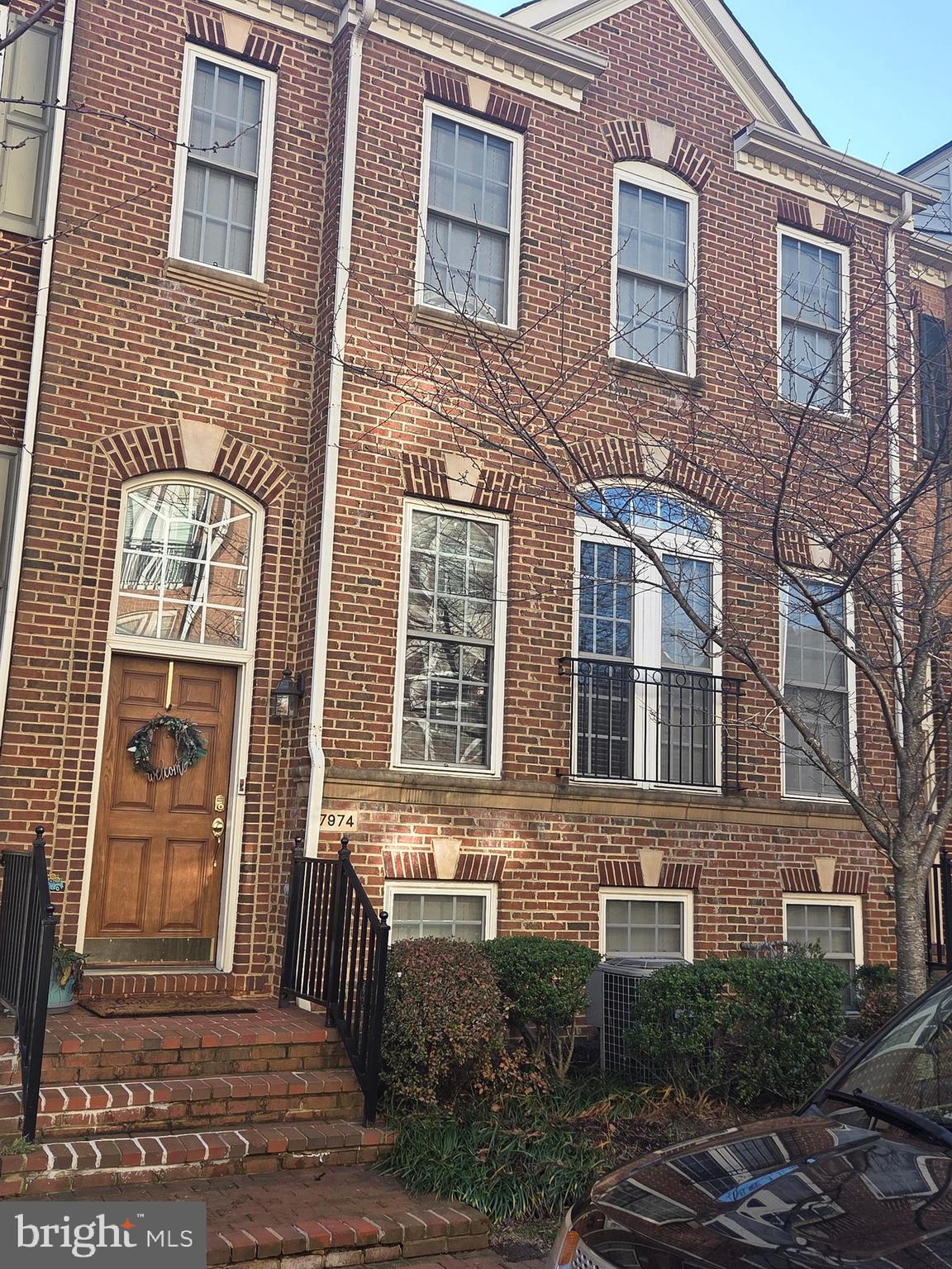7974 Vigne Court Vienna, VA 22182 - Photo 1 of 2 a view of a brick building front with many windows