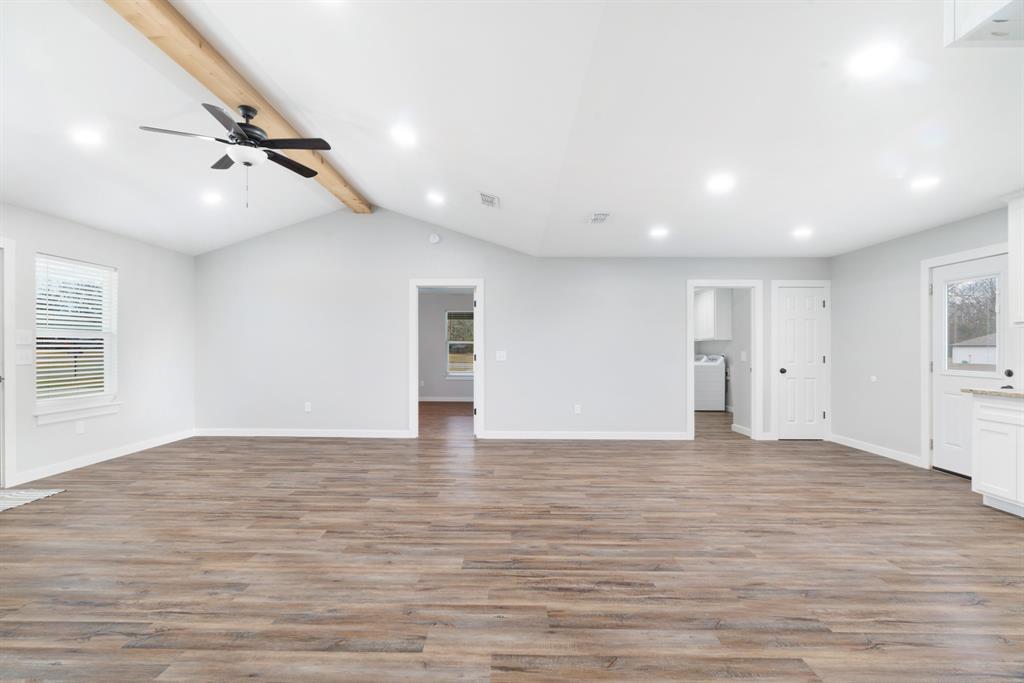 19 Private Road Paris, TX 75460 - Photo 5 of 18 a view of empty room with wooden floor and window