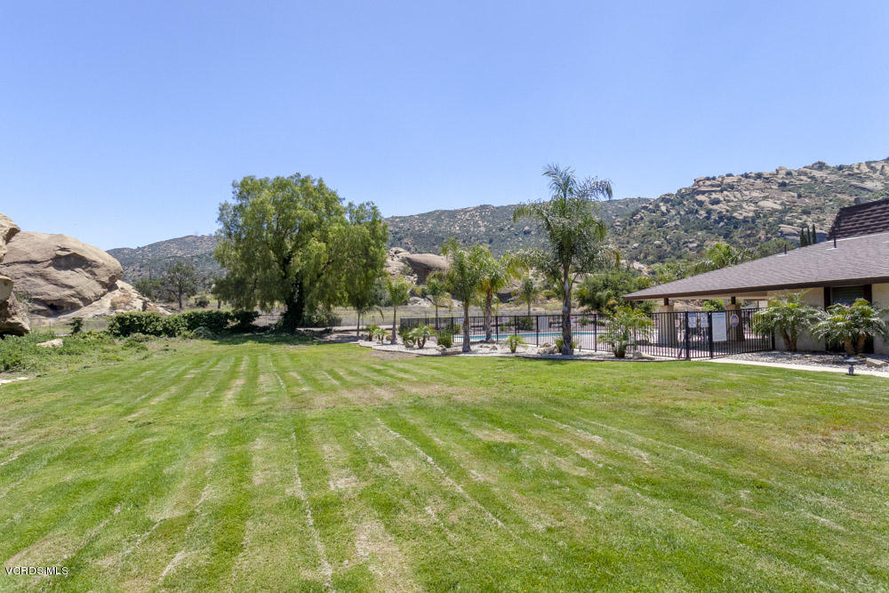 6480 Katherine Road, Unit SP 7 Simi Valley, CA 93063 - Photo 22 of 24 a swimming pool with trees in the background