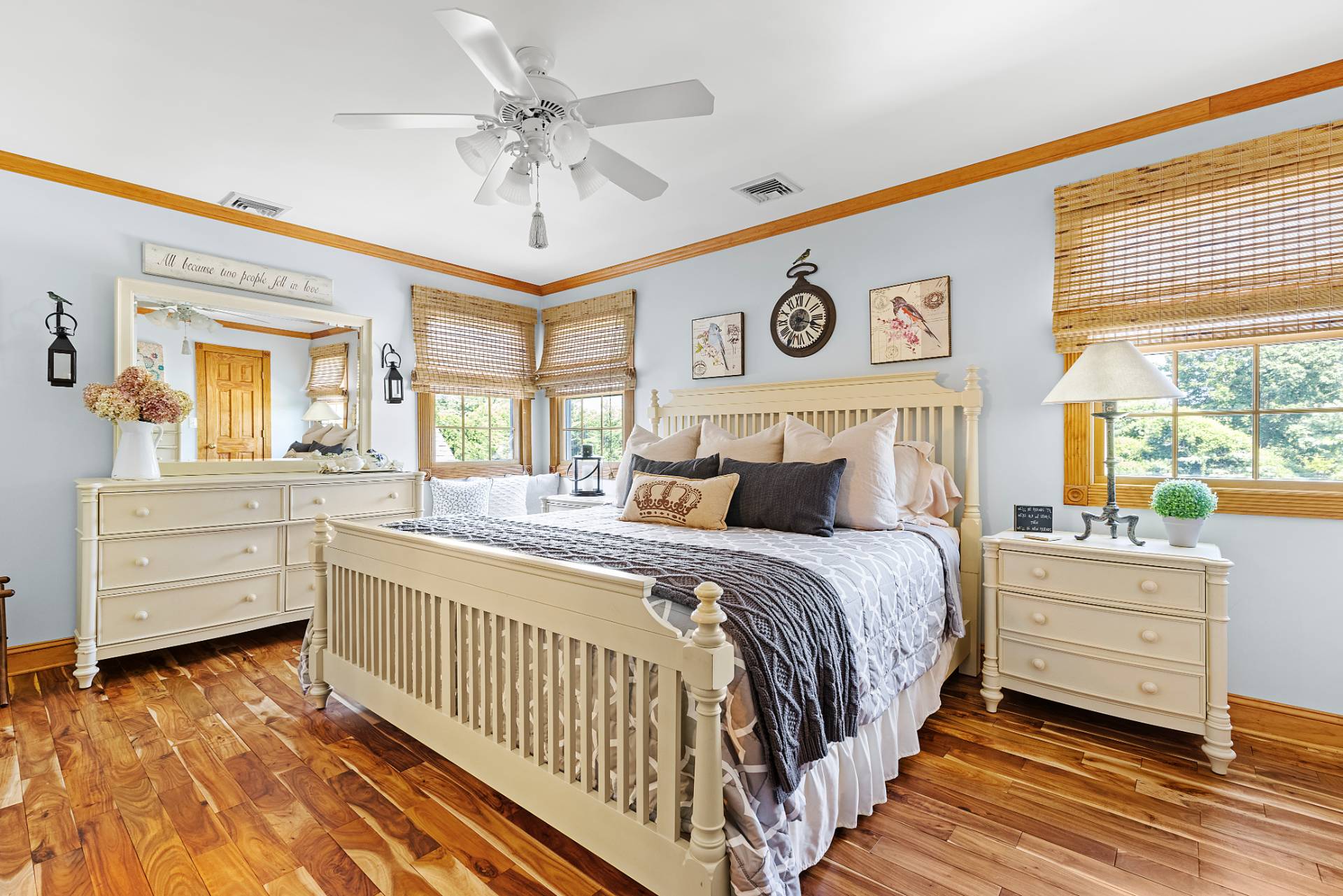 Undisclosed Address Remsenburg, NY 11960 - Photo 16 of 41 a bedroom with a large bed and a chandelier