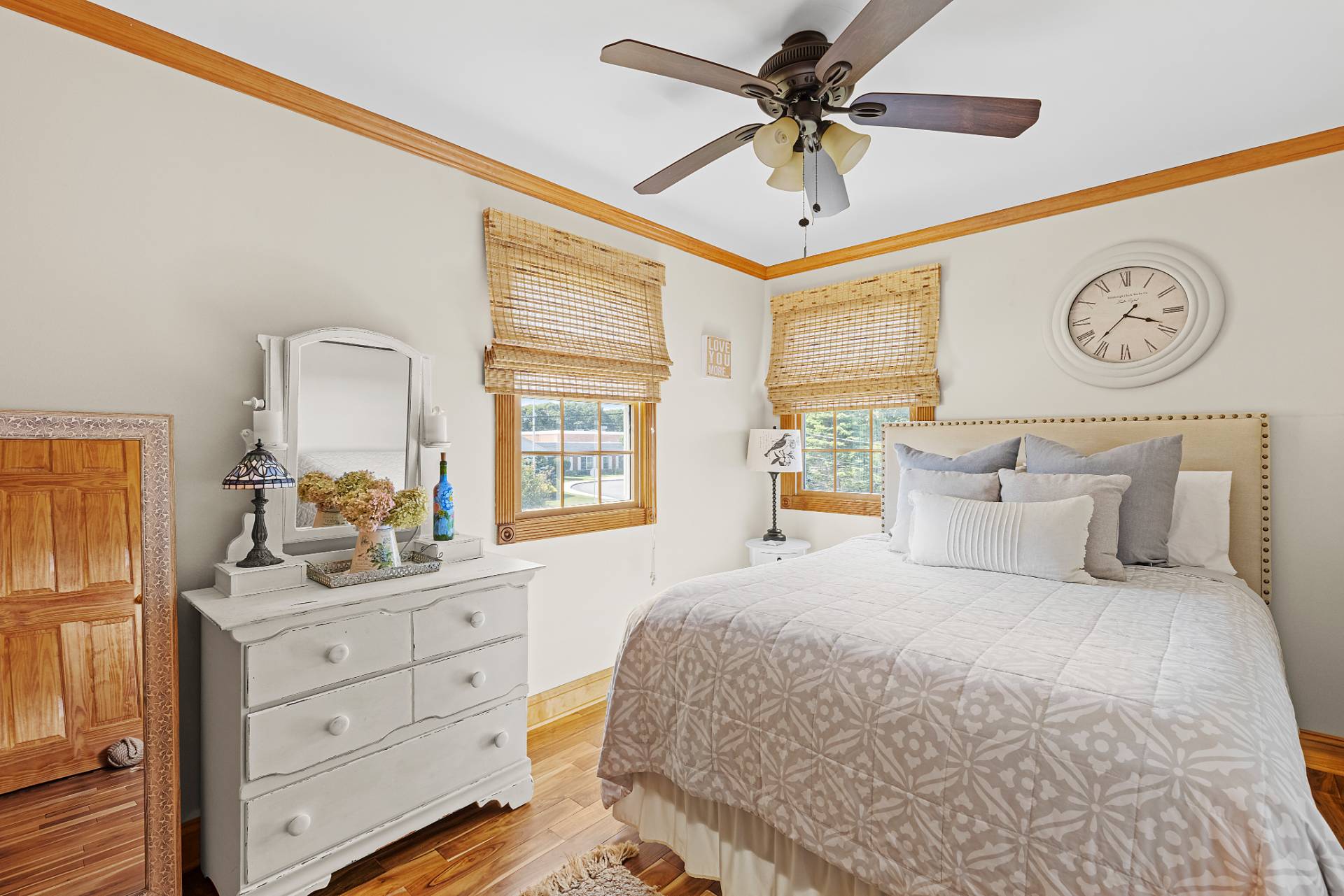 Undisclosed Address Remsenburg, NY 11960 - Photo 19 of 41 a bedroom with a large bed and a chandelier