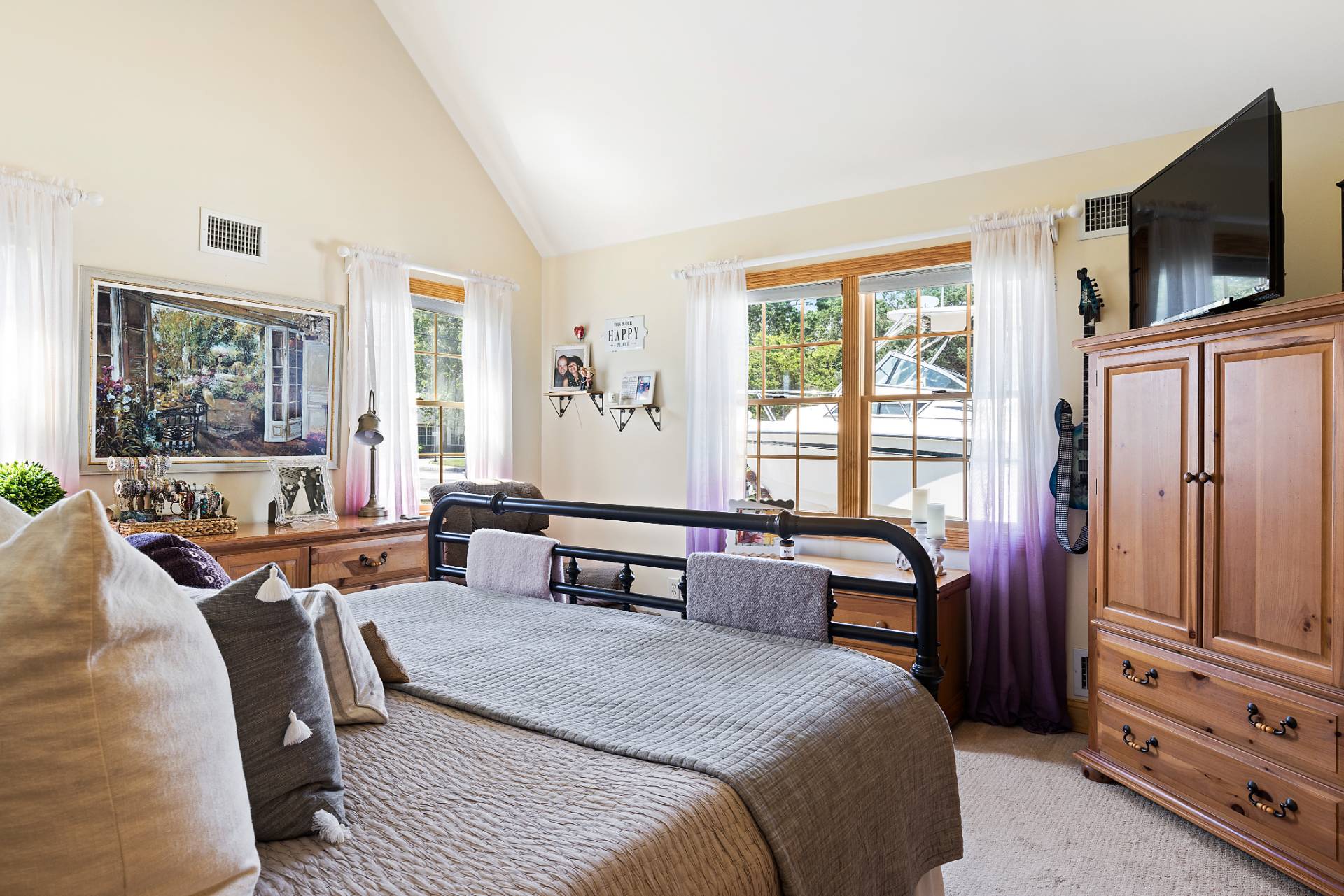 Undisclosed Address Remsenburg, NY 11960 - Photo 22 of 41 a bedroom with a bed and a flat screen tv