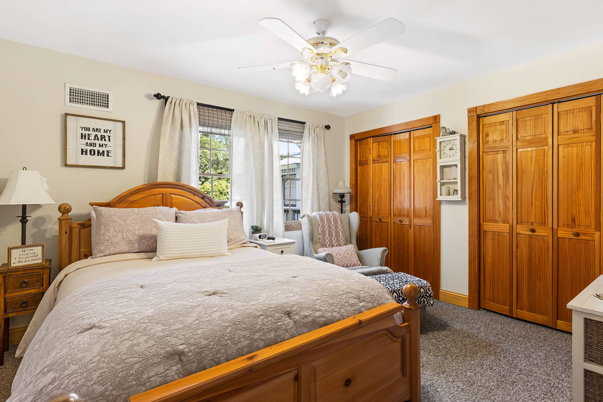 Undisclosed Address Remsenburg, NY 11960 - Photo 25 of 41 a bedroom with a large bed and a chandelier