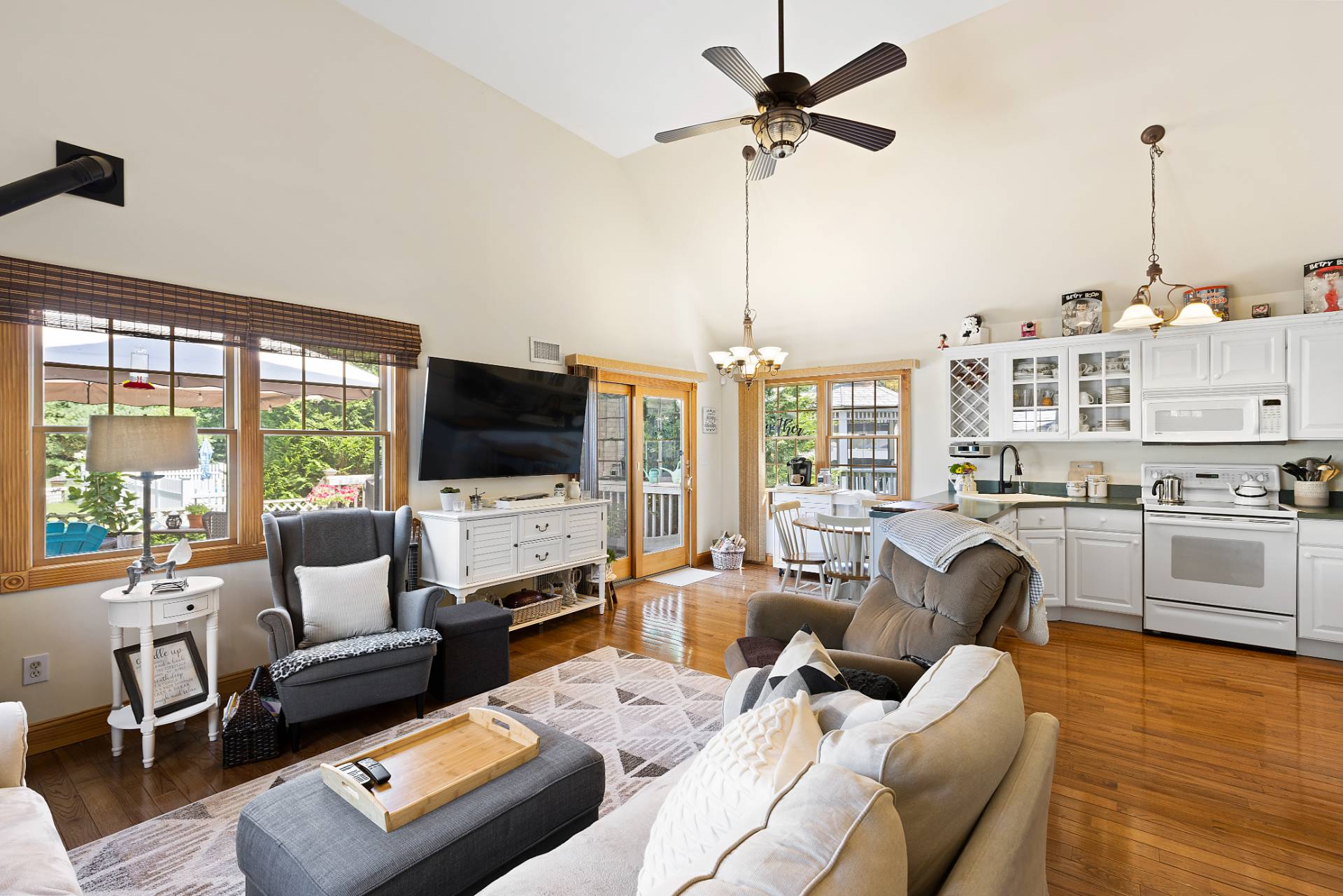 Undisclosed Address Remsenburg, NY 11960 - Photo 28 of 41 a living room with furniture a flat screen tv and a large window