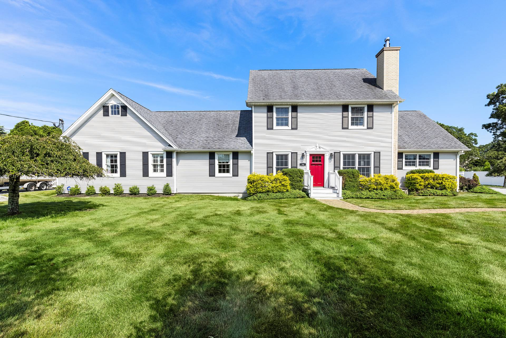 Undisclosed Address Remsenburg, NY 11960 - Photo 30 of 41 a front view of a house with a yard table and chairs