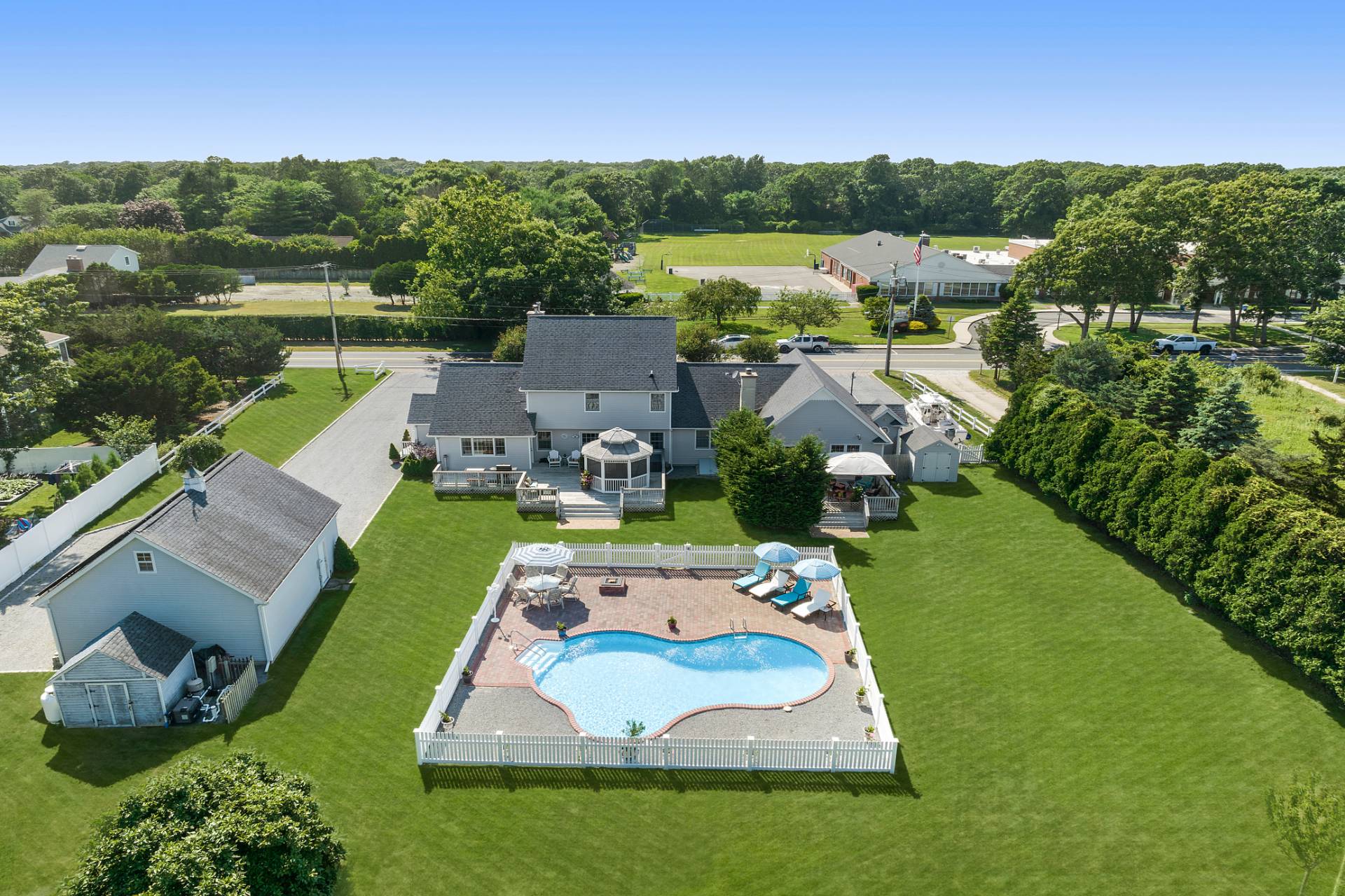 Undisclosed Address Remsenburg, NY 11960 - Photo 3 of 41 an aerial view of a house with garden space and outdoor seating