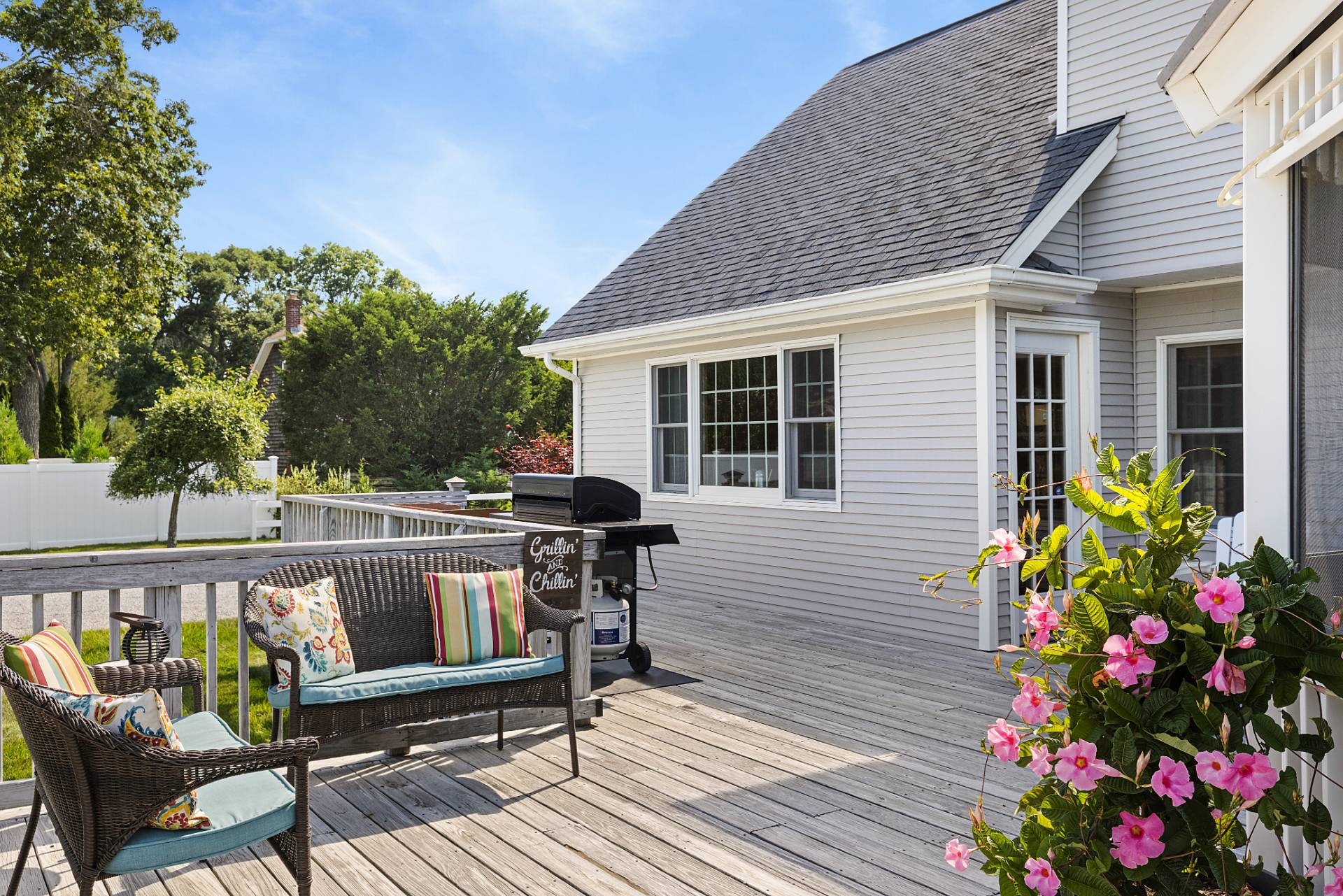 Undisclosed Address Remsenburg, NY 11960 - Photo 34 of 41 a view of a patio with table and chairs and potted plants