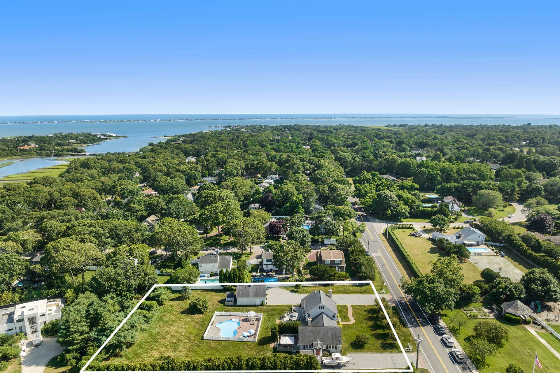 Undisclosed Address Remsenburg, NY 11960 - Photo 40 of 41 an aerial view of multiple houses with outdoor space