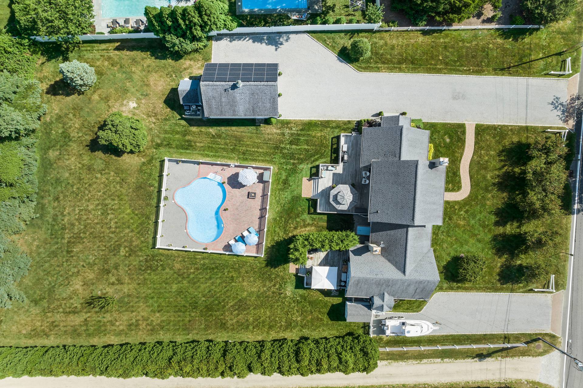 Undisclosed Address Remsenburg, NY 11960 - Photo 41 of 41 an aerial view of a house with a garden and pool