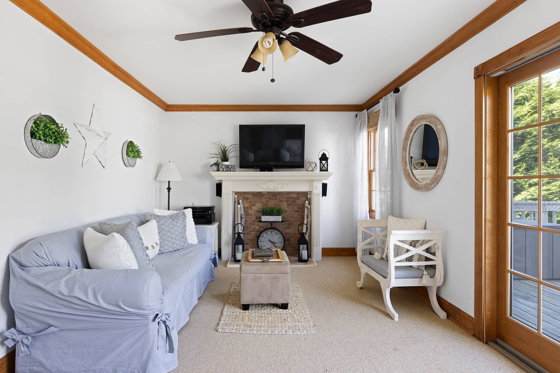 Undisclosed Address Remsenburg, NY 11960 - Photo 6 of 41 a living room with furniture a fireplace and a flat screen tv
