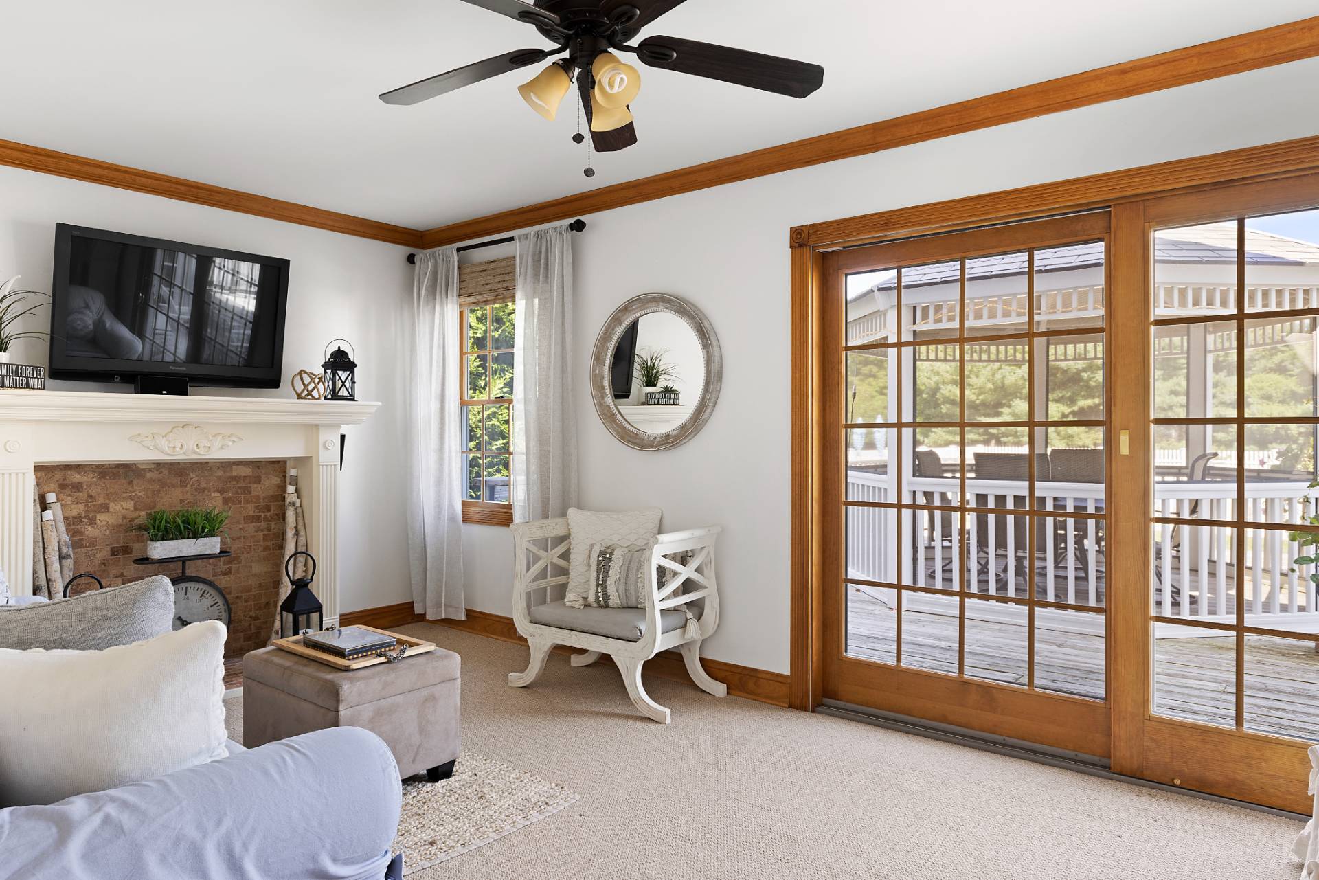 Undisclosed Address Remsenburg, NY 11960 - Photo 7 of 41 a living room with furniture a flat screen tv and a fireplace