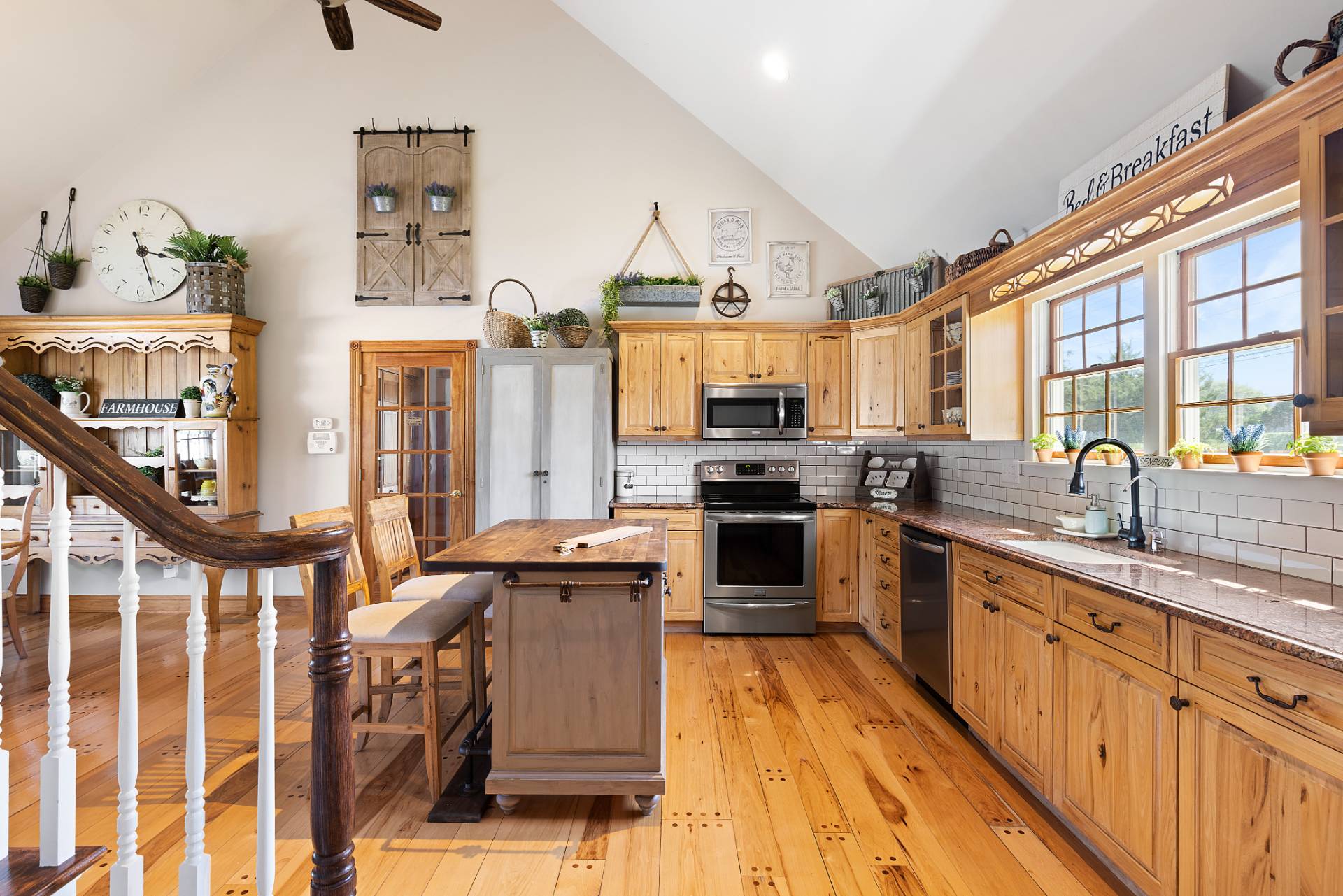 Undisclosed Address Remsenburg, NY 11960 - Photo 10 of 41 a kitchen with stainless steel appliances a stove a sink dishwasher a oven with cabinets and wooden floor