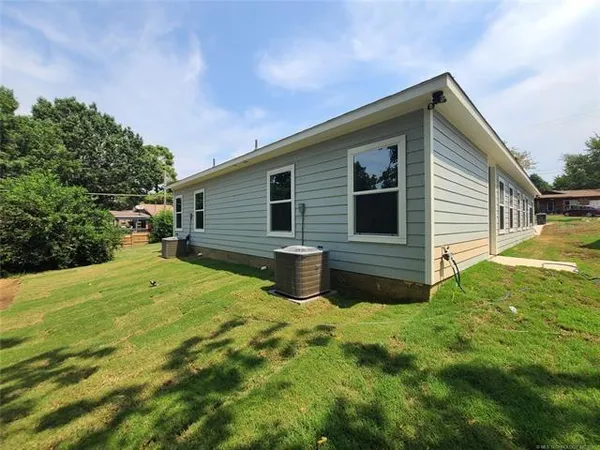 a view of backyard with outdoor space