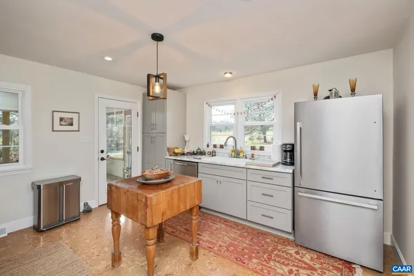 a kitchen with a stove and a refrigerator