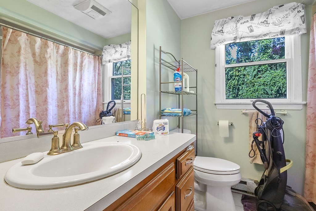 4 Josephine Street Franklin, MA 02038 - Photo 18 of 33 a bathroom with a sink a toilet and a mirror