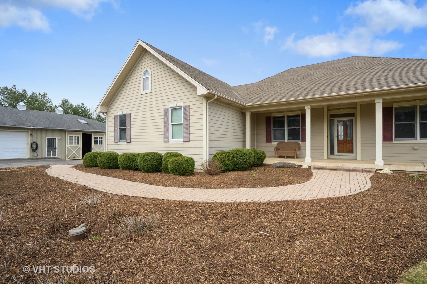 41-w580 McDonald Road Elgin, IL 60124 - Photo 1 of 25 a view of a house with a yard and potted plants