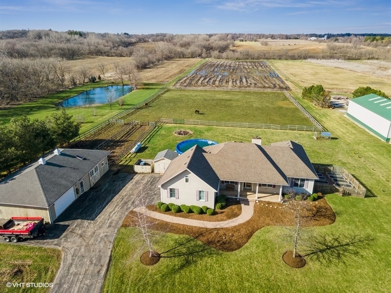 41-w580 McDonald Road Elgin, IL 60124 - Photo 3 of 25 an aerial view of residential houses with outdoor space and swimming pool
