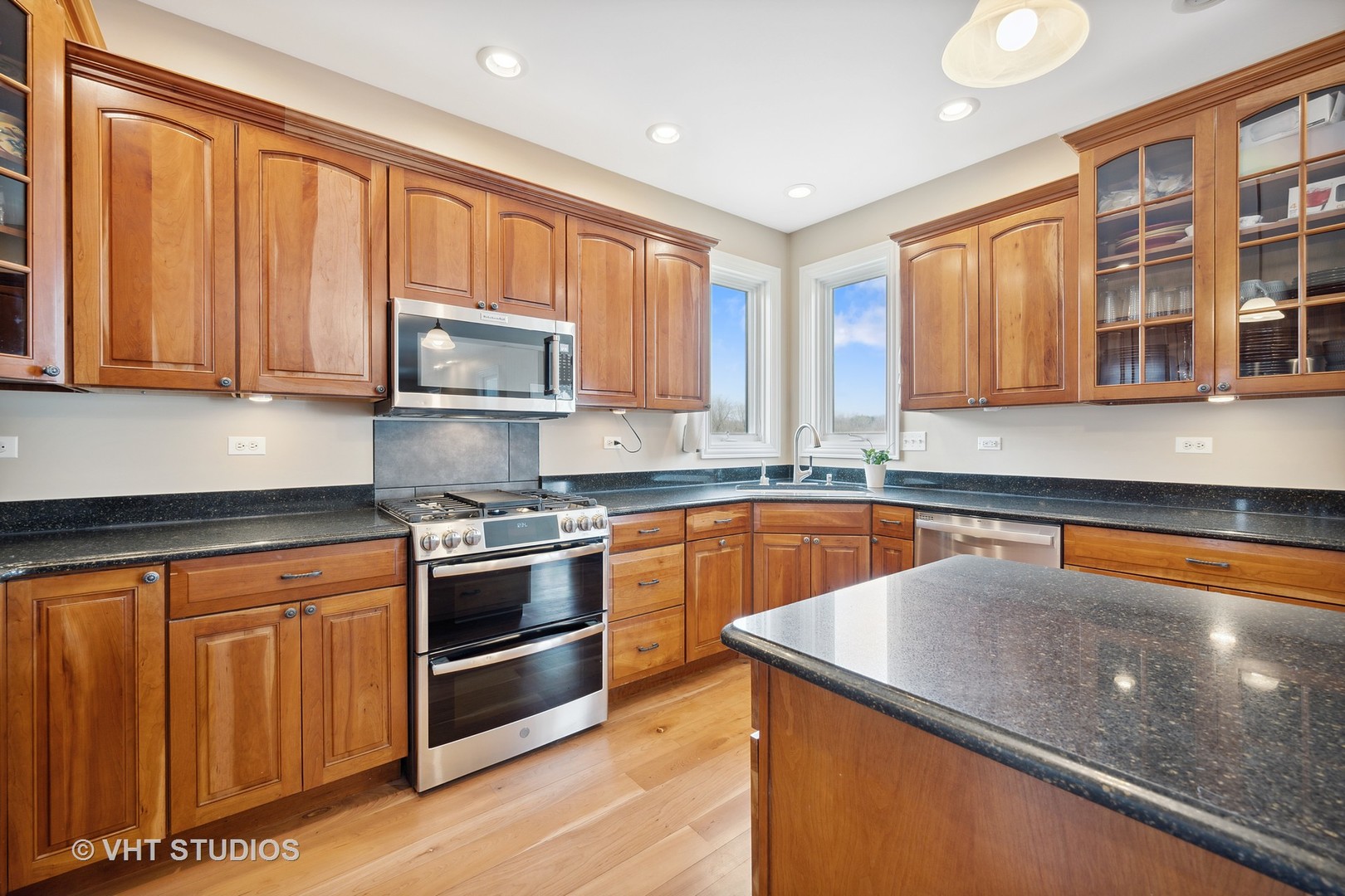 41-w580 McDonald Road Elgin, IL 60124 - Photo 4 of 25 a kitchen with stainless steel appliances granite countertop wooden cabinets a stove and a sink