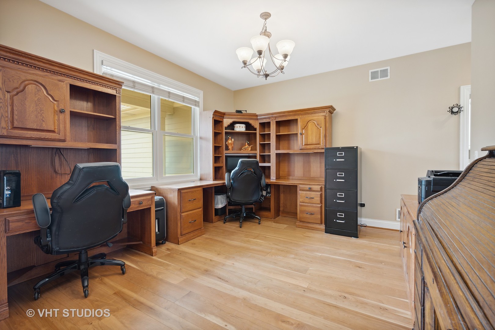 41-w580 McDonald Road Elgin, IL 60124 - Photo 7 of 25 a view of a workspace with furniture and a window