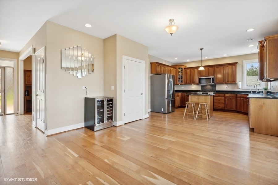 41-w580 McDonald Road Elgin, IL 60124 - Photo 9 of 25 a view of a kitchen with furniture and wooden floor