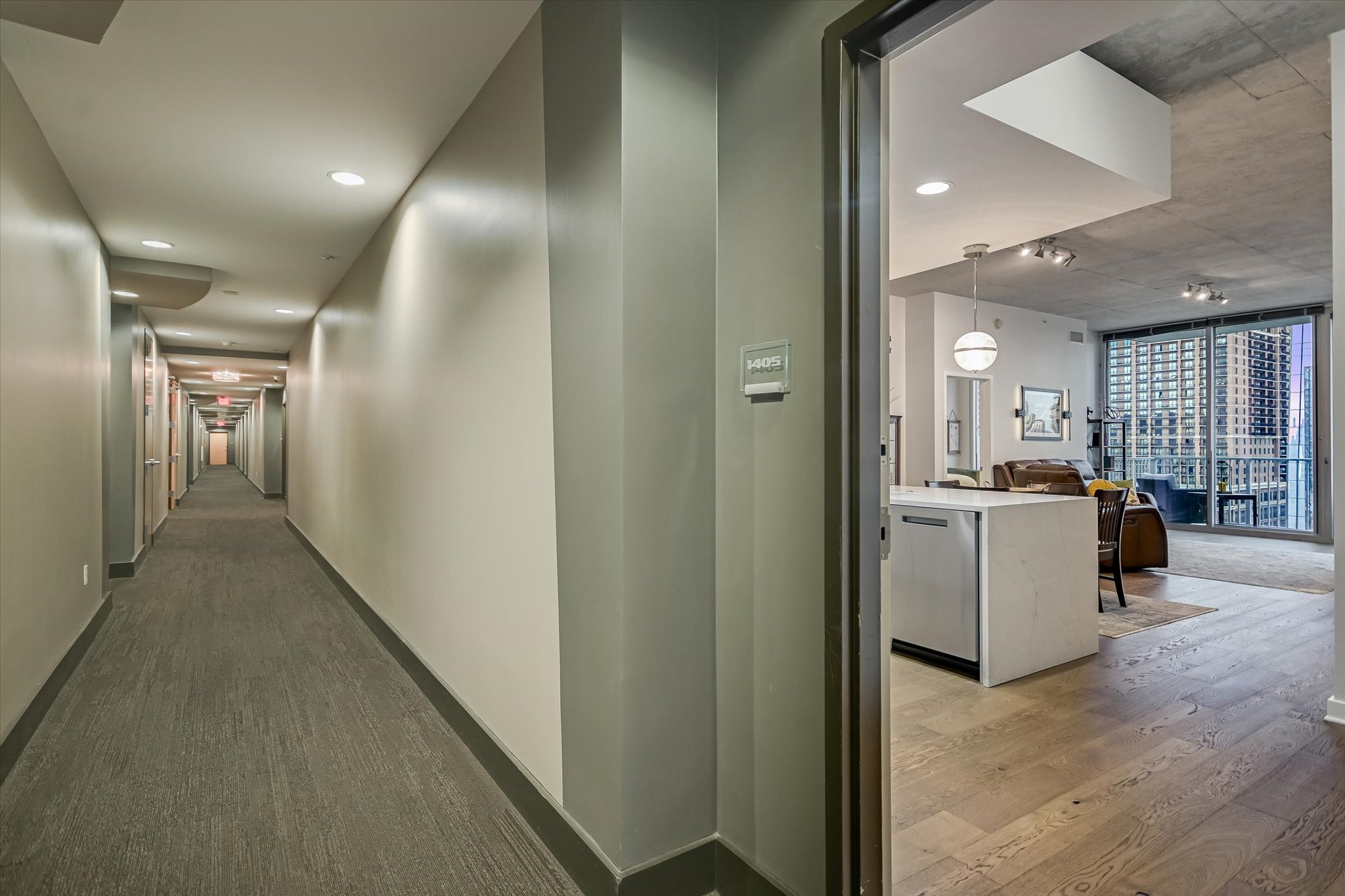 360 Nueces Street, Unit 1405 Austin, TX 78701 - Photo 26 of 40 a view of a hallway with kitchen and wooden floor