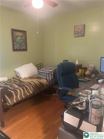 a bedroom with a bed and cabinets