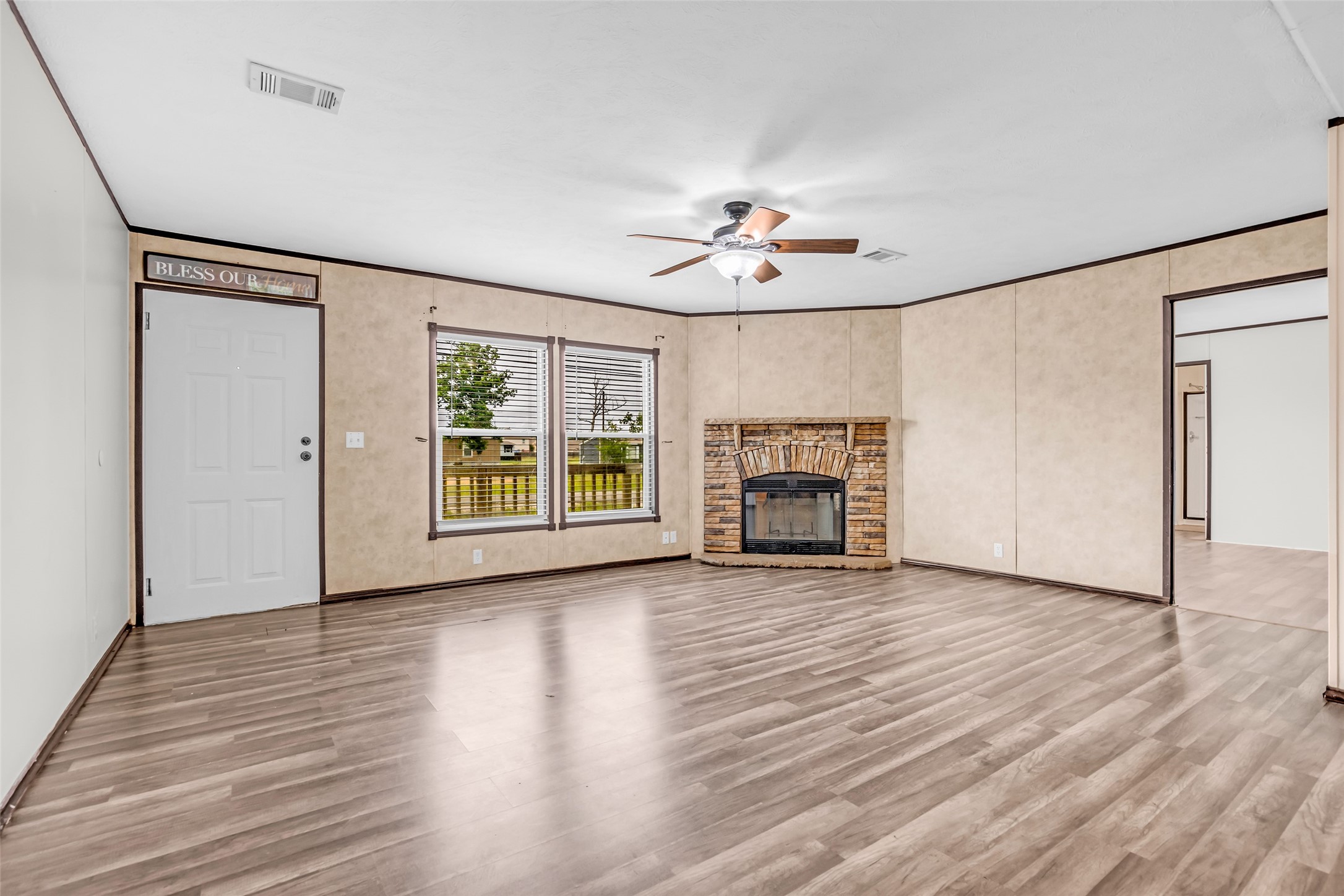 15158 Schank Road Conroe, TX 77306 - Photo 2 of 12 Spacious living room with a cozy fire place